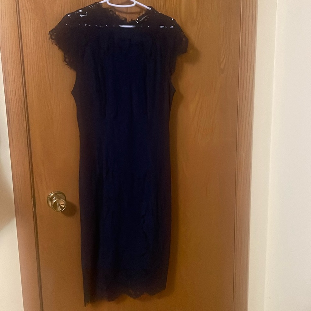 New Navy Lace Dress.  Cap sleeve, back zips.  Below the knee dress.  New